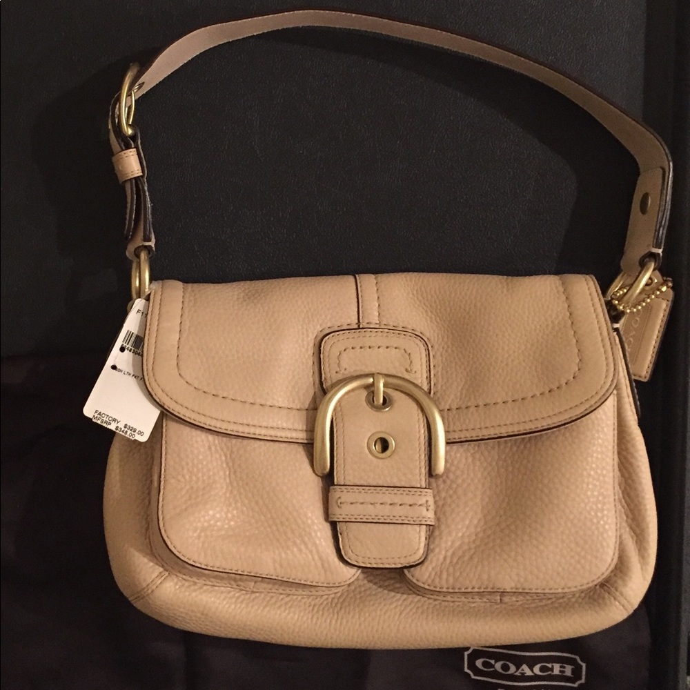 NWT Coach leather purse with brass hardware.